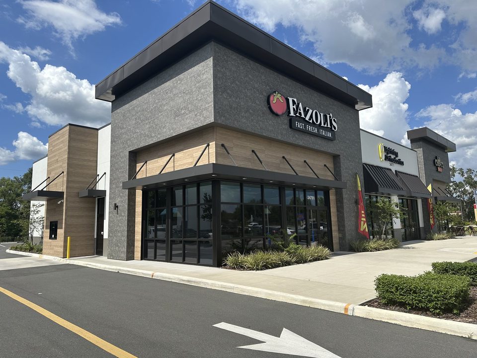 Black awnings across a restaurant exterior